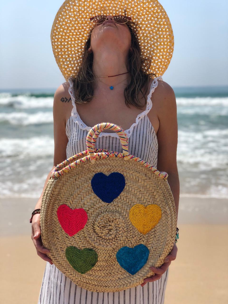 Handwoven Round Moroccan Straw Bag with Colorful Hearts | Handmade Palm Leaf Beach Tote | ArtisanNomad