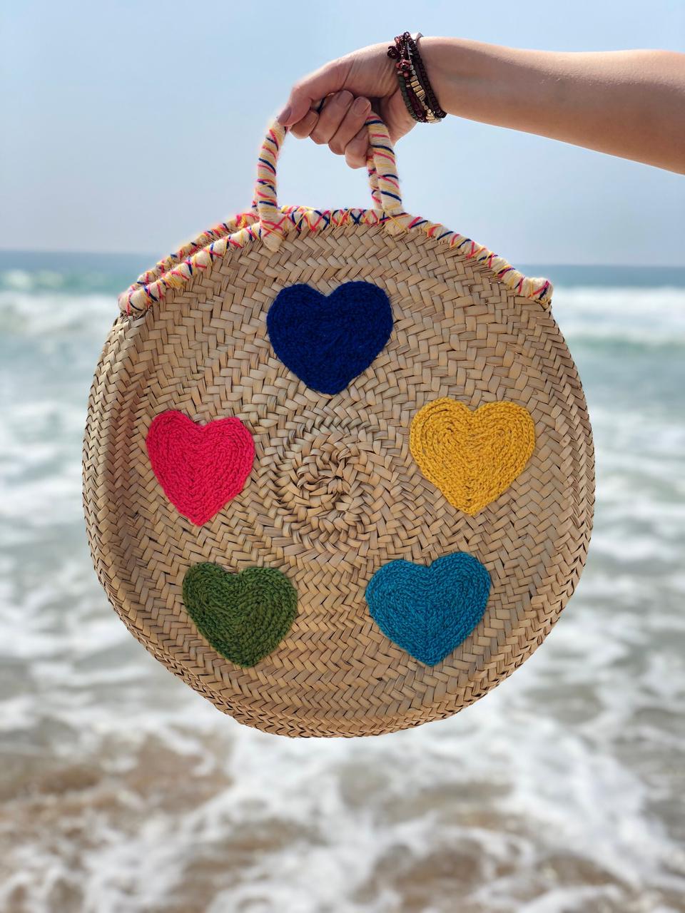 Handwoven Round Moroccan Straw Bag with Colorful Hearts | Handmade Palm Leaf Beach Tote | ArtisanNomad
